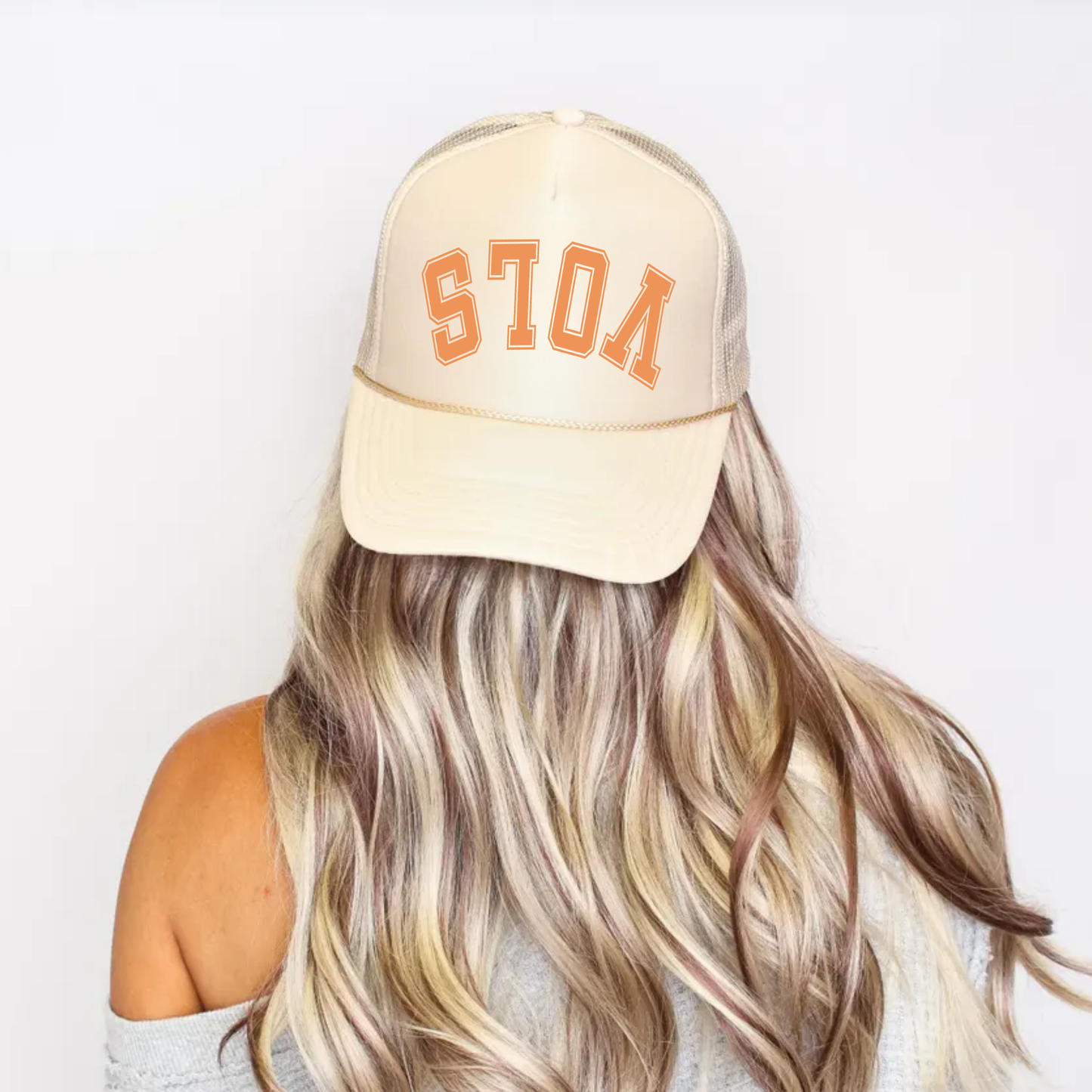 Upside down VOLS trucker hat worn by model showing reversed trendy sports lettering