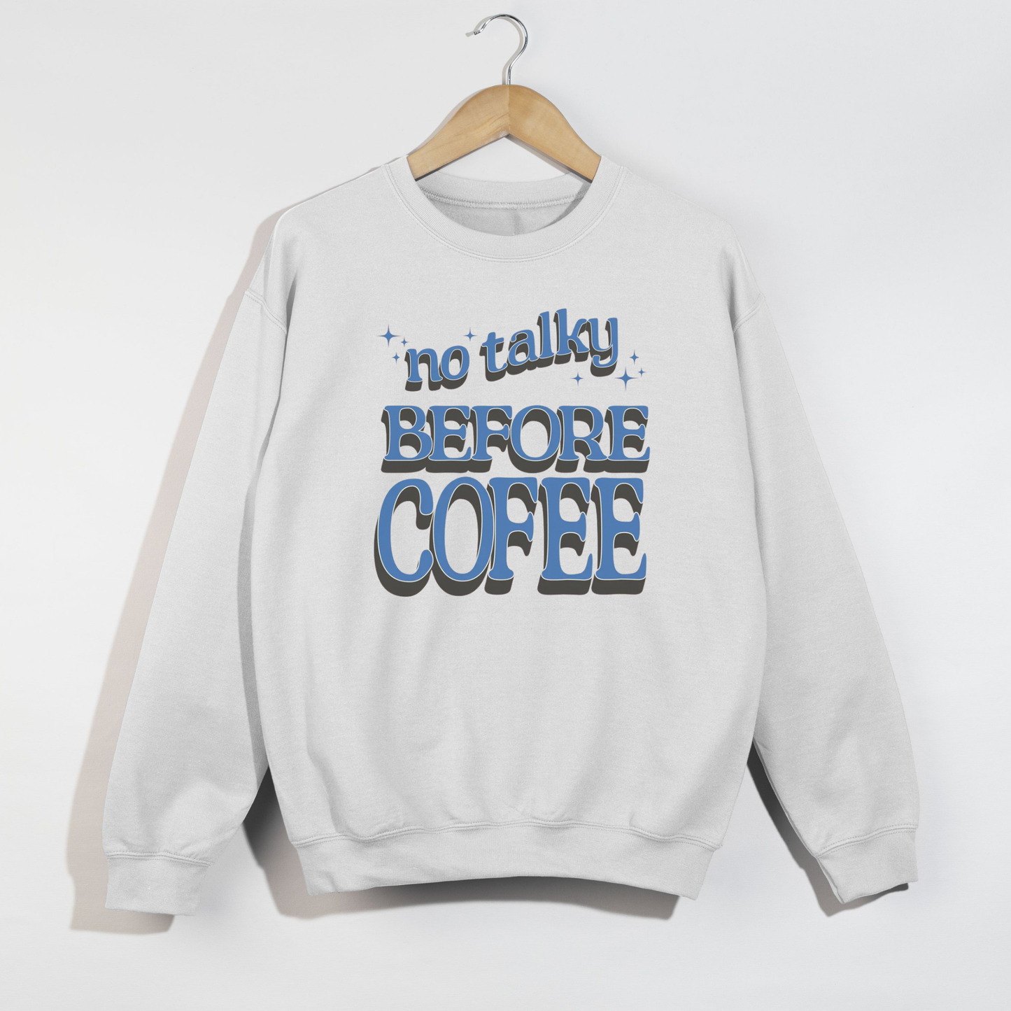 White crewneck sweatshirt with blue ‘No Talky Before Coffee’ retro font design
