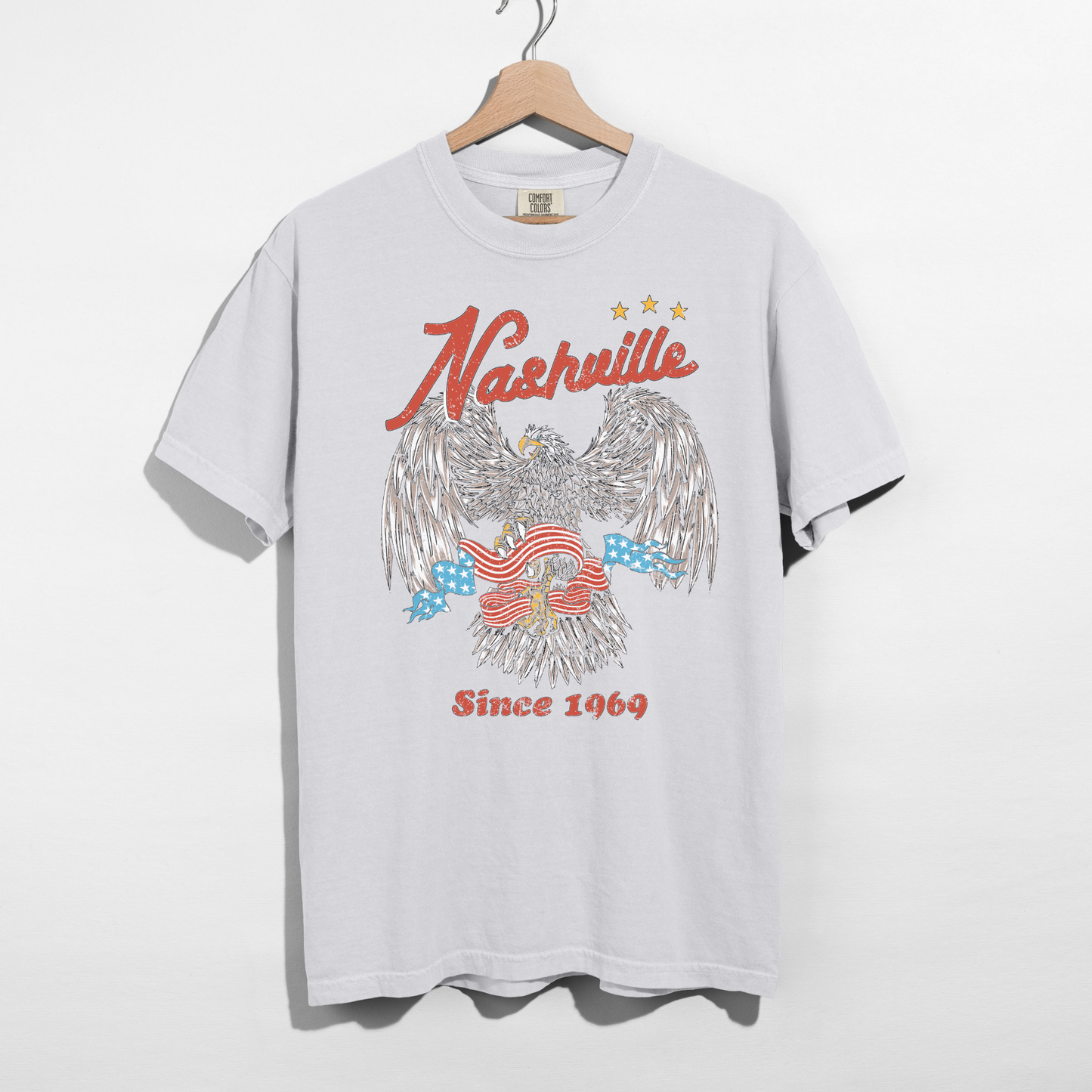 White Nashville eagle graphic tee vintage western shirt with American flag design since 1969