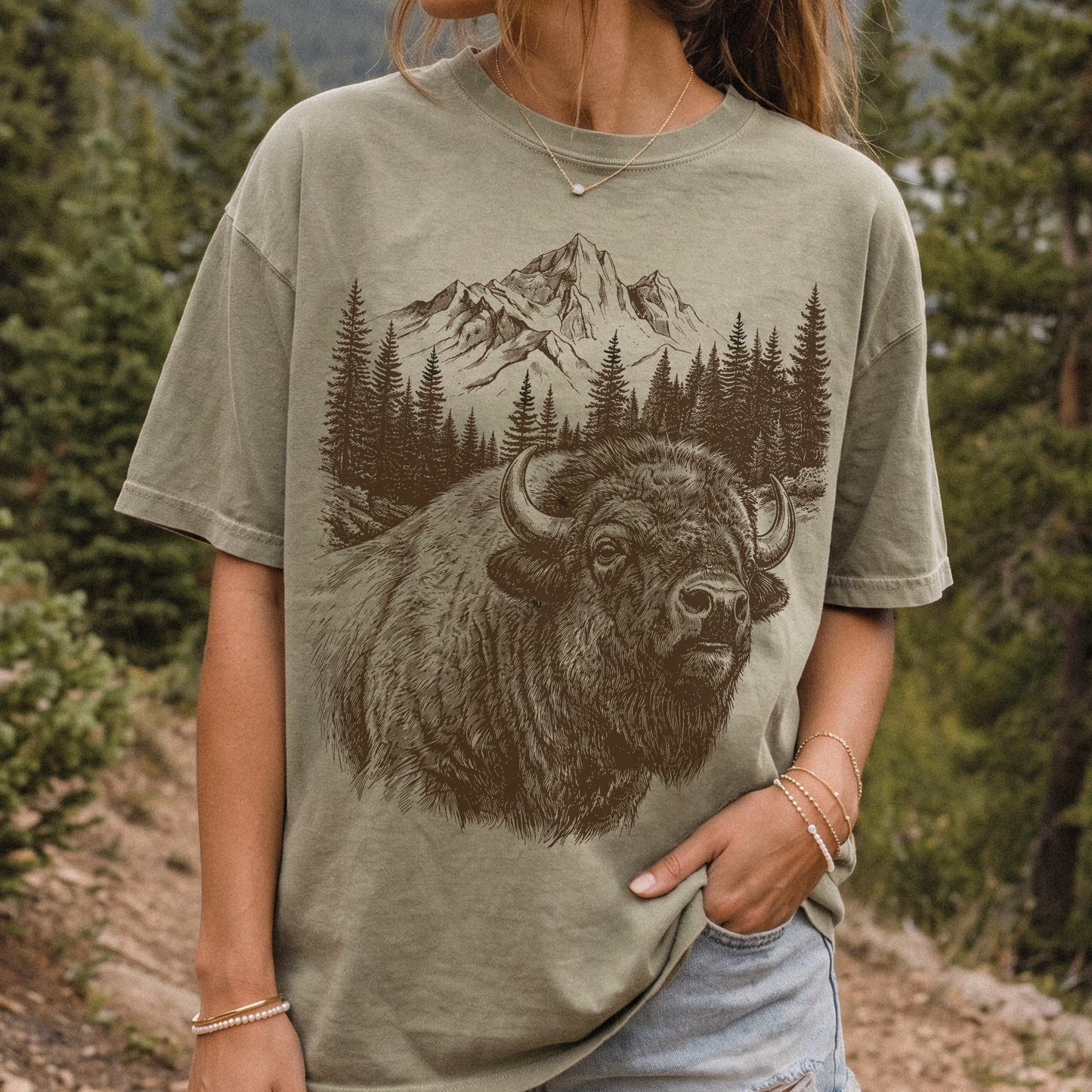 Khaki vintage buffalo graphic t-shirt with rustic mountain wilderness artwork, oversized relaxed fit for western outdoor style.