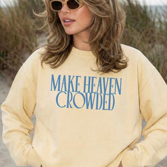 Model wearing yellow “Make Heaven Crowded” faith sweatshirt outdoors neutral aesthetic
