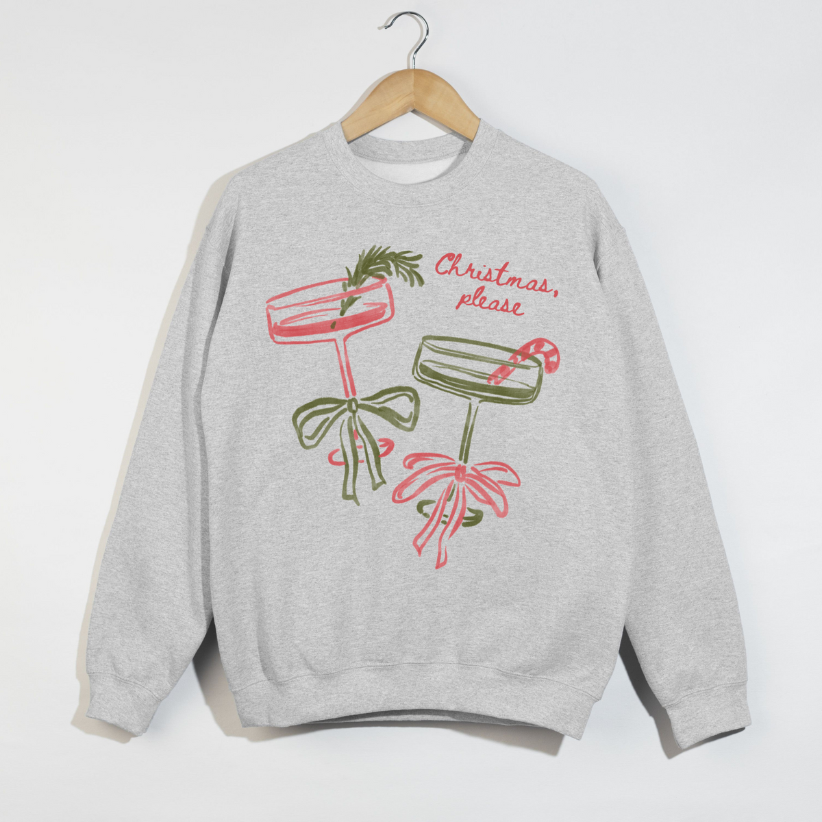 Gray sweatshirt with Christmas-themed graphics and text on a white background