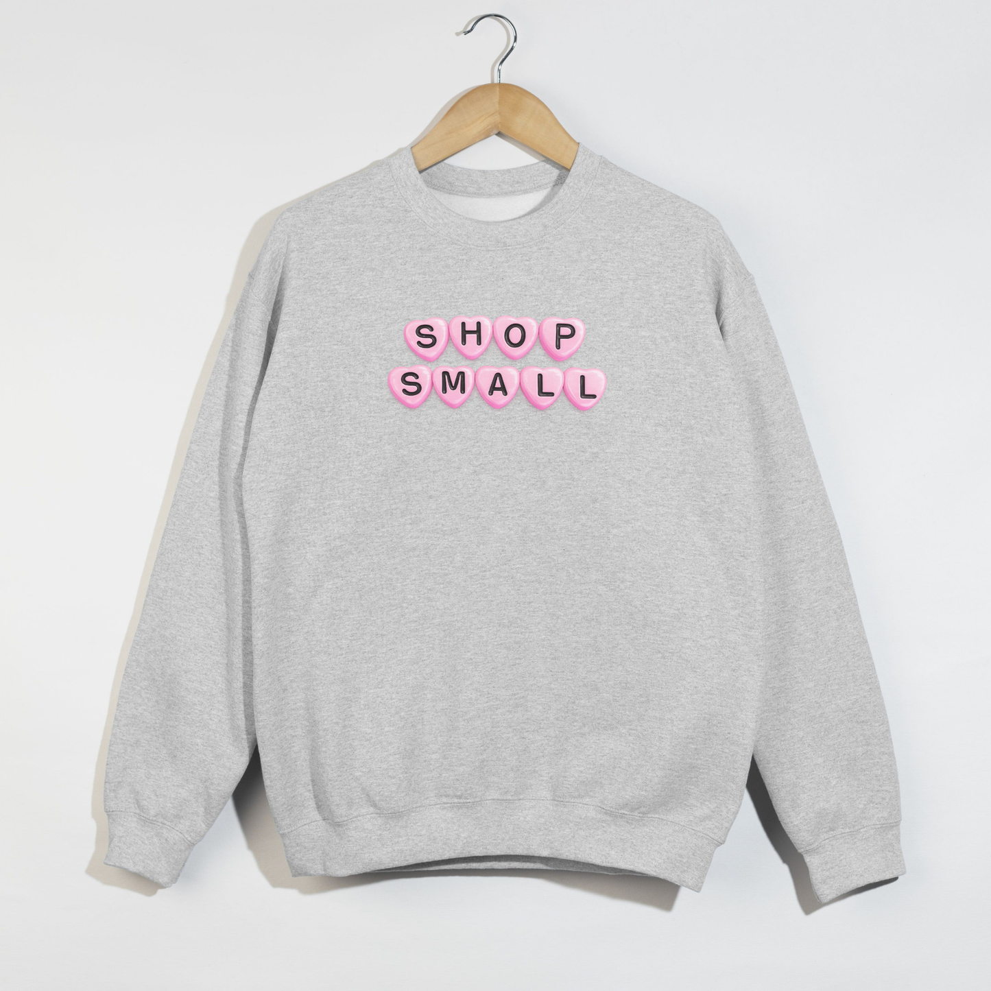Ash grey Shop Small sweatshirt on hanger with bold small business graphic
