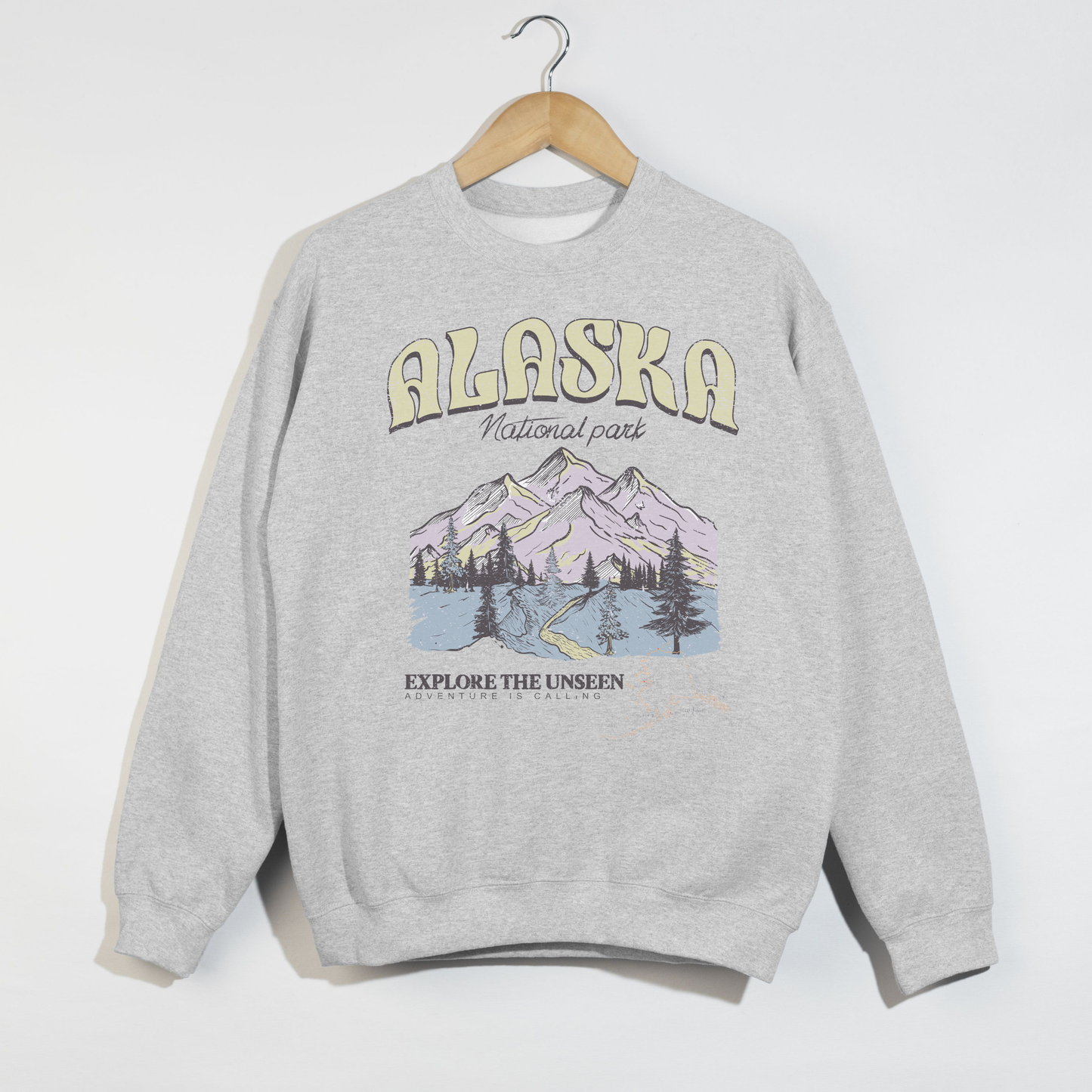 ash grey alaska national park sweatshirt with mountain graphic and explore the unseen text