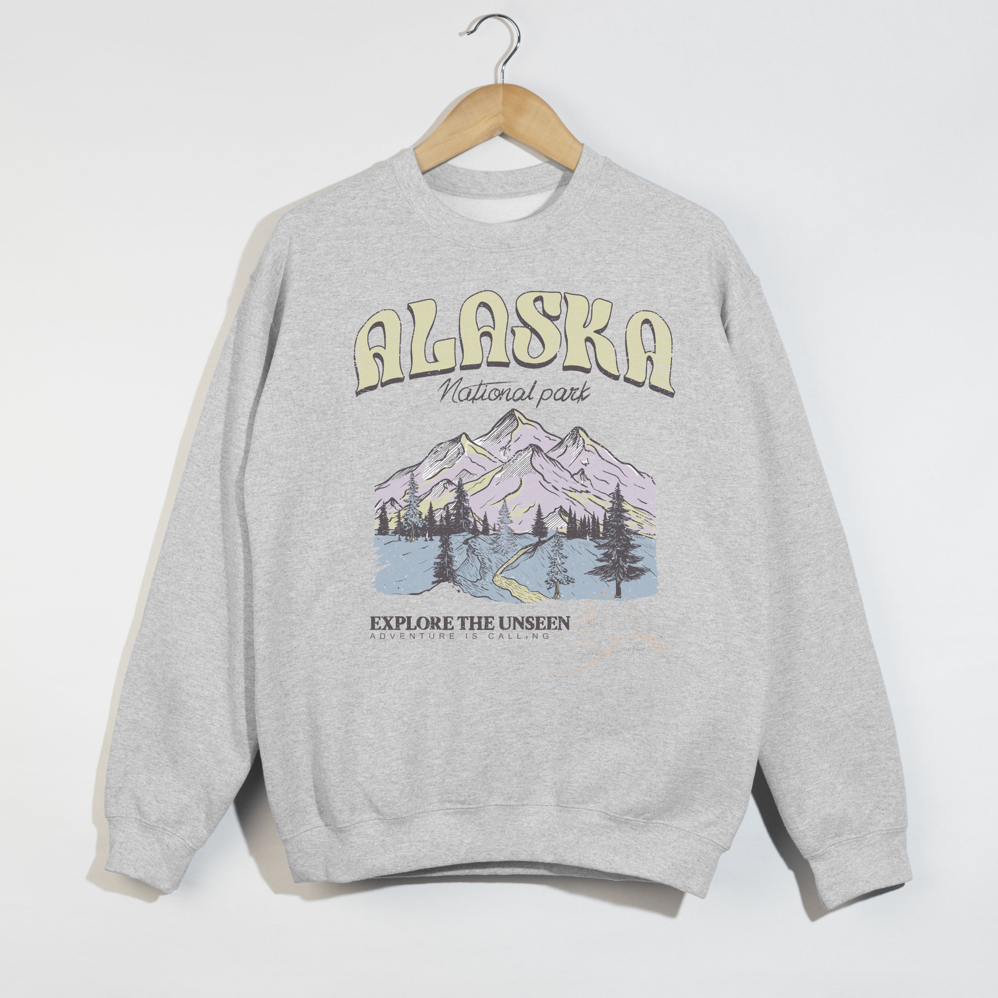 ash grey alaska national park sweatshirt with mountain graphic and explore the unseen text