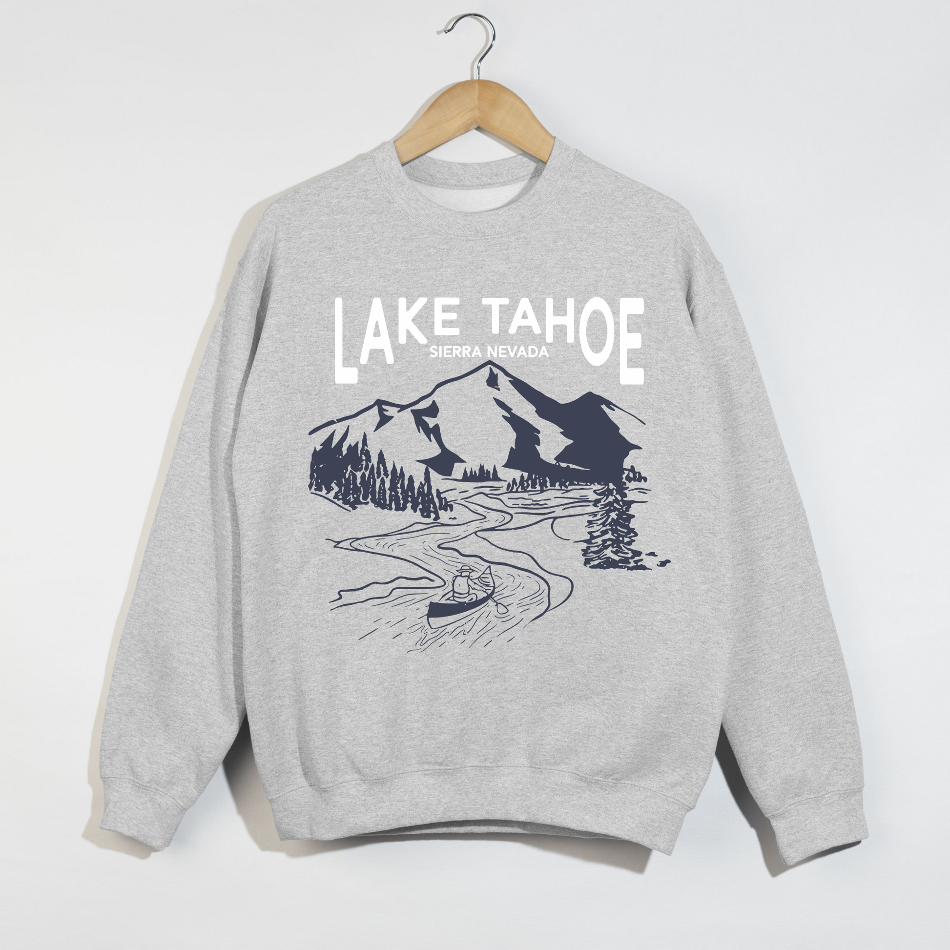 Gray Lake Tahoe Sierra Nevada graphic sweatshirt hanging on wooden hanger