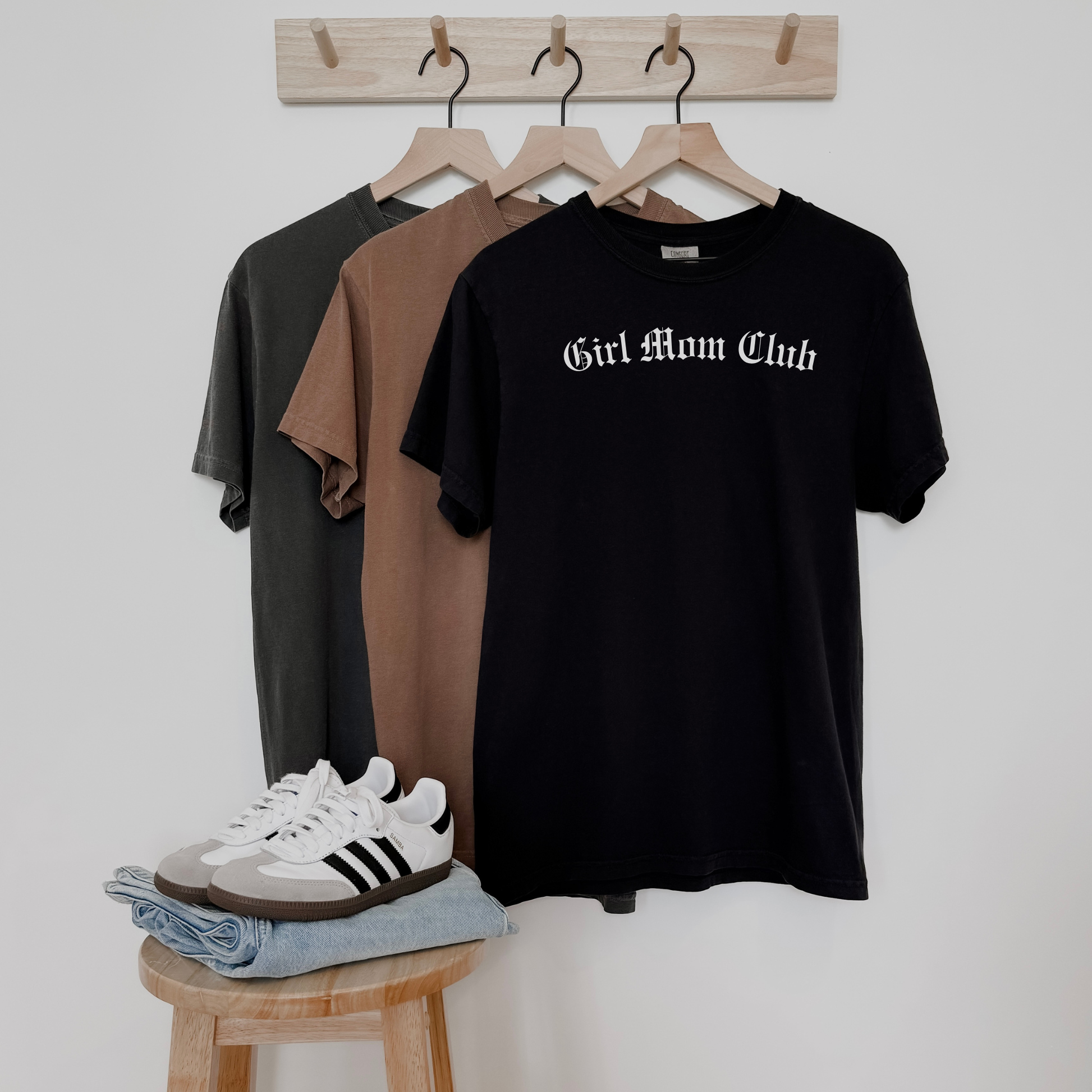 Girl Mom Club vintage-style graphic tee on garment-dyed t-shirts in black, brown, and charcoal