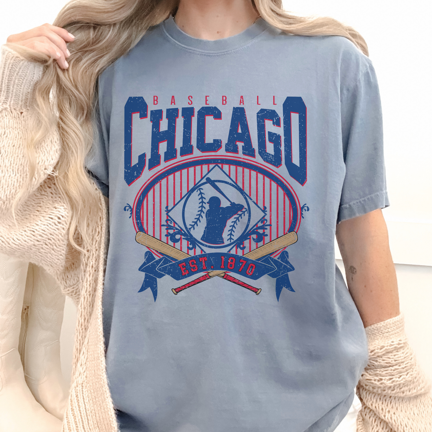 Person wearing a blue 'Chicago Baseball' t-shirt with red and white accents.