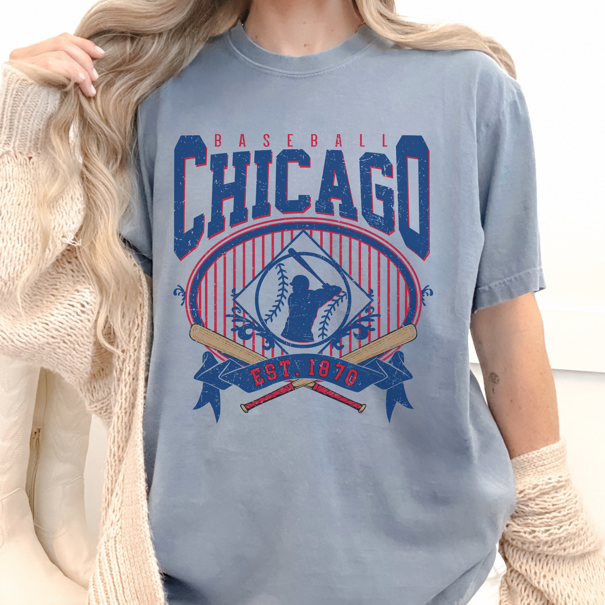 Person wearing a blue 'Chicago Baseball' t-shirt with red and white accents.
