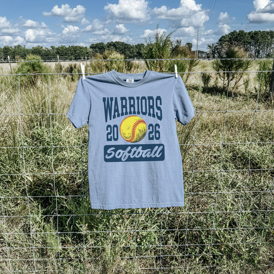 Blue jean Warriors Softball 2026 unisex school spirit shirt hanging outdoors with softball design
