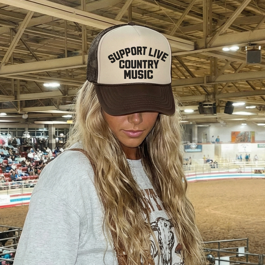 brown and tan Otto 31-069 structured firm front hat featuring Support Live Country Music graphic at indoor rodeo event