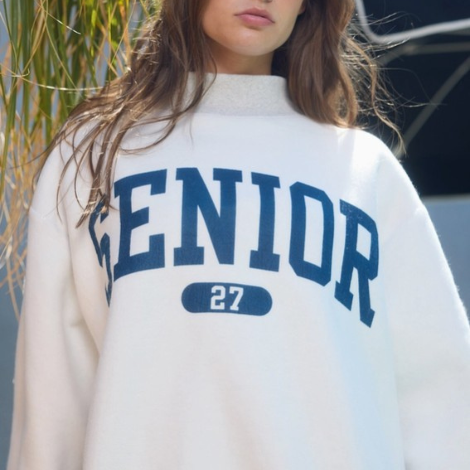 Reversible Senior 2027 pullover showcasing navy varsity lettering with matching “27” graphic and oversized relaxed fit for graduating seniors.