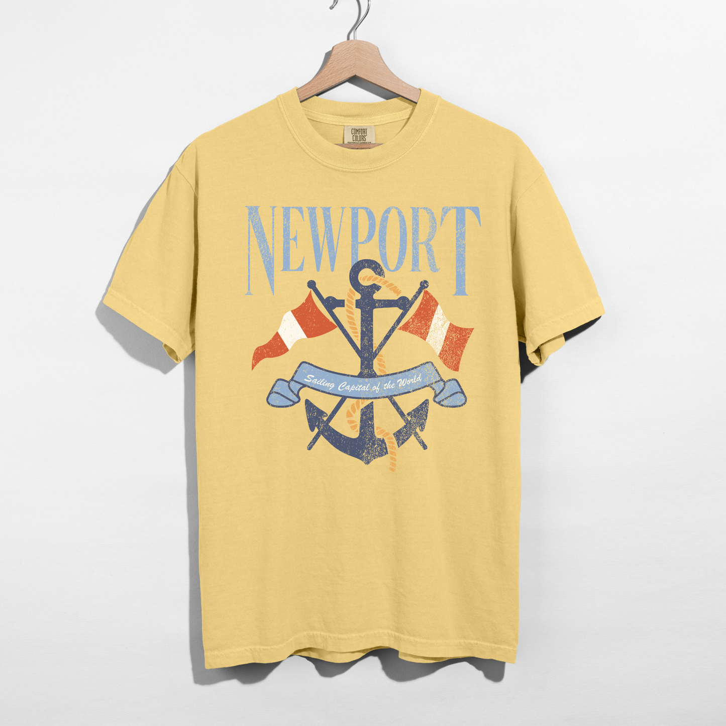 Butter yellow Newport anchor graphic tee with vintage nautical design on hanger