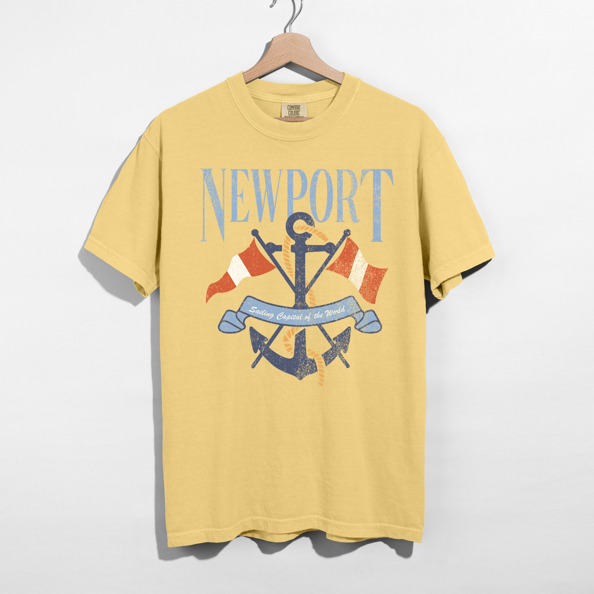 Butter yellow Newport anchor graphic tee with vintage nautical design on hanger