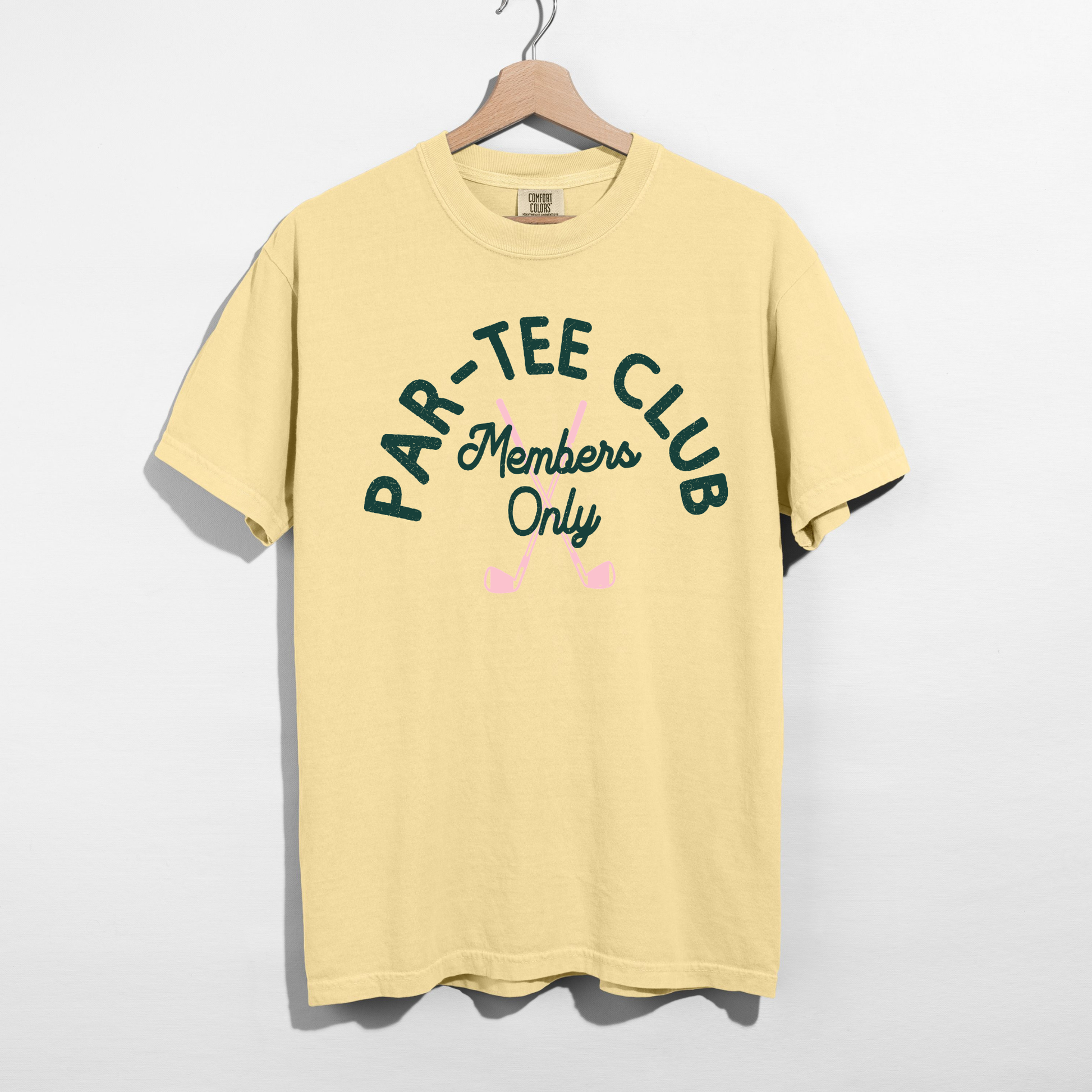 Butter yellow Par-Tee Club Members Only golf graphic t-shirt featuring distressed green lettering and pink crossed golf clubs.