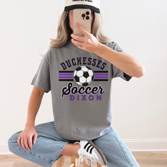 Woman wearing oversized grey Duchesses Soccer Dixon t-shirt with casual outfit