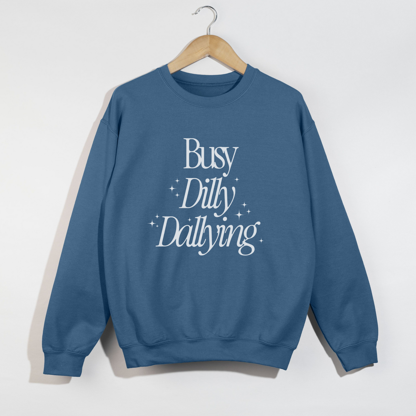 Blue sweatshirt with 'Busy Dilly Dallying' text on a white background