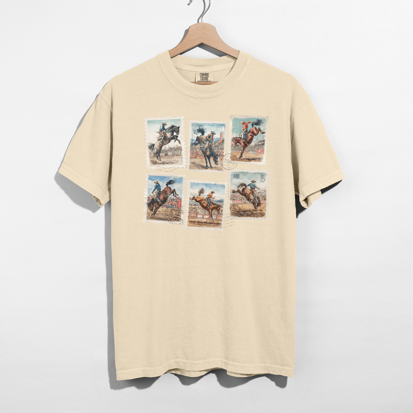 Vintage rodeo stamp graphic tee on white Comfort Colors shirt hanging on wooden hanger