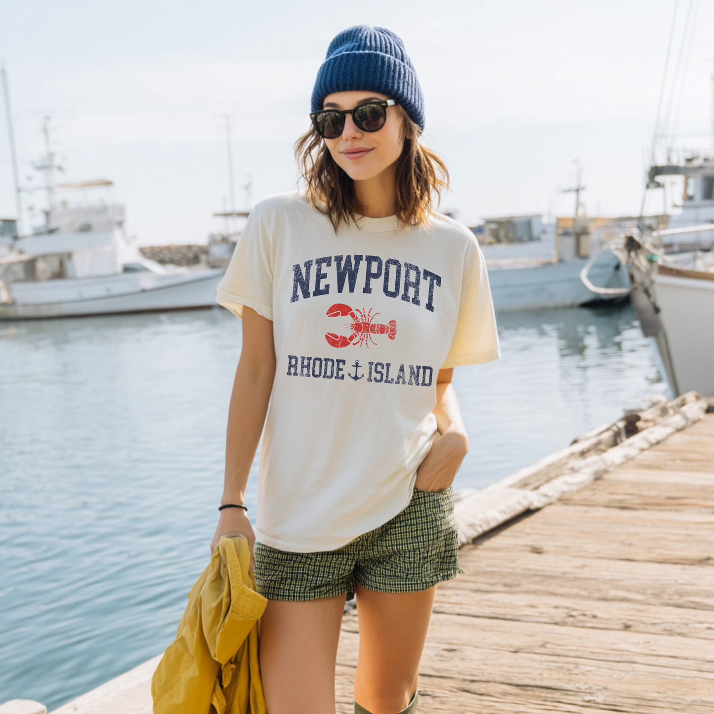 Woman wearing Newport Rhode Island t-shirt with lobster graphic by marina coastal summer outfit