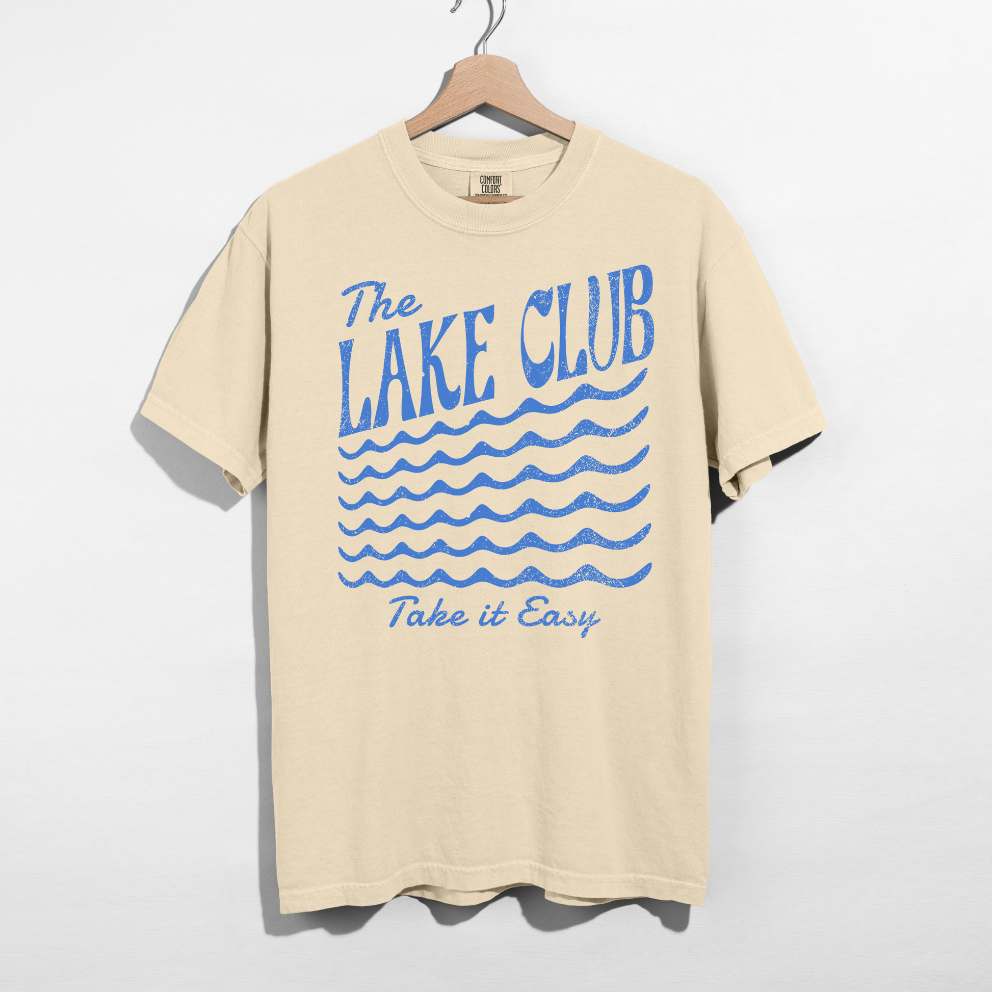 Ivory Comfort Colors t-shirt featuring The Lake Club Take It Easy vintage lake life graphic with distressed blue lettering