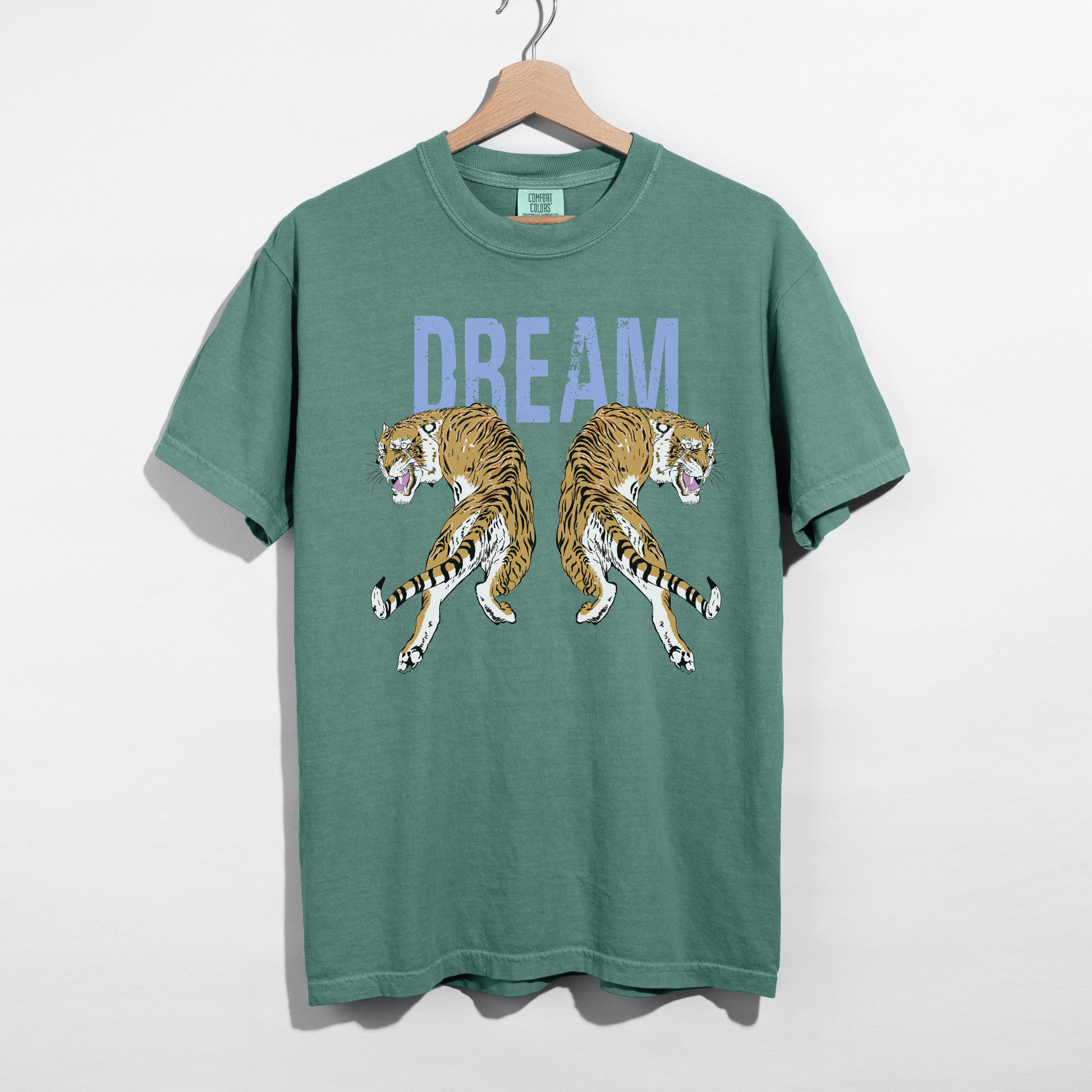 Comfort Colors bay green Dream Tiger graphic tee hanging on hanger with vintage tiger artwork