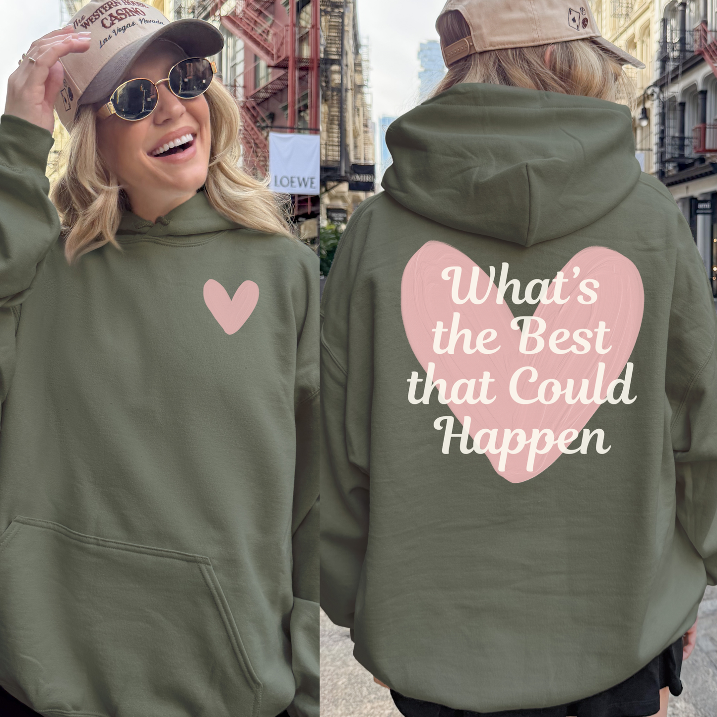 “Back of military green hoodie with pink heart and quote ‘What’s the Best That Could Happen.’”
