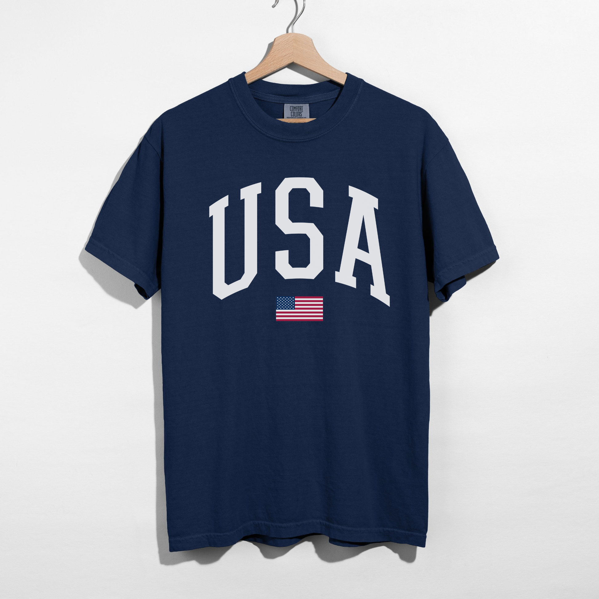 Navy USA varsity patriotic graphic tee with white letters and American flag accent