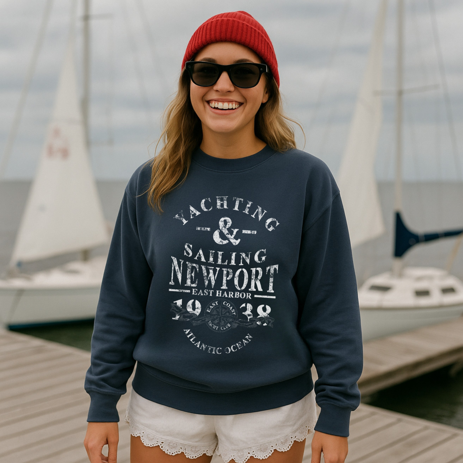 woman wearing navy yachting and sailing sweatshirt coastal preppy outfit dock marina lifestyle look