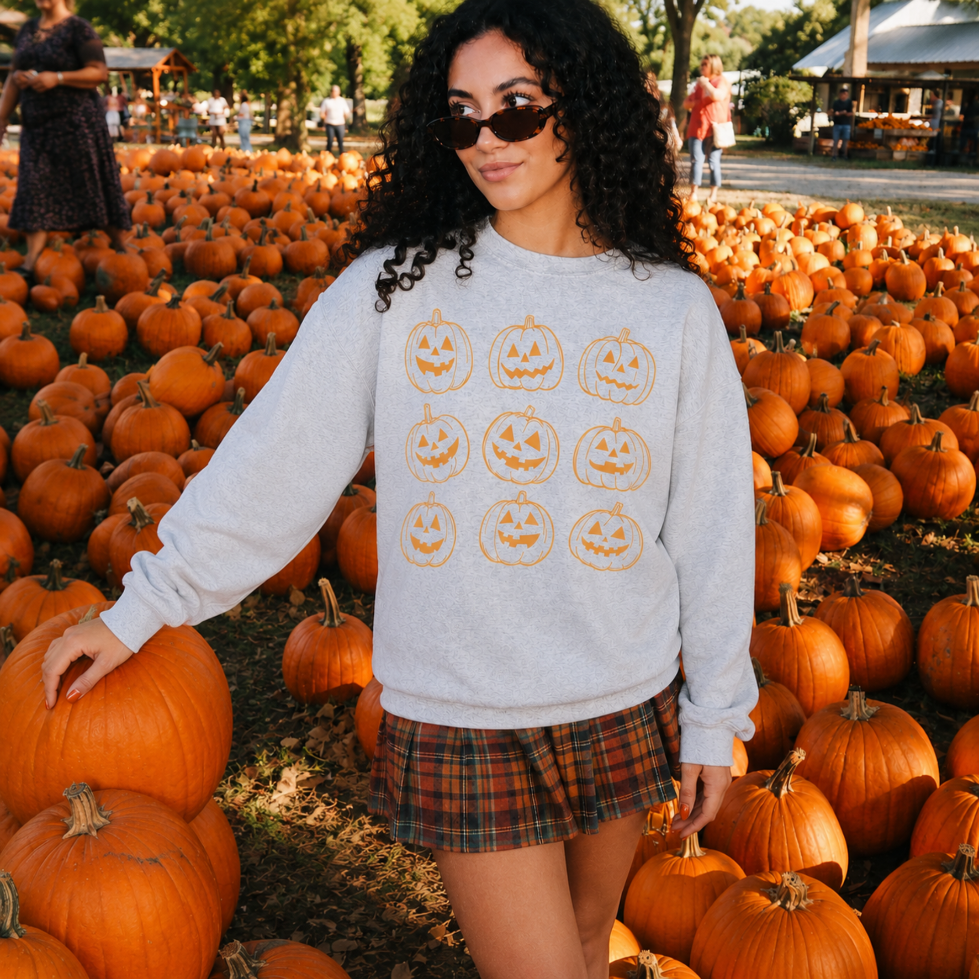 Front view of oatmeal heather pumpkin graphic crewneck sweatshirt at pumpkin patch