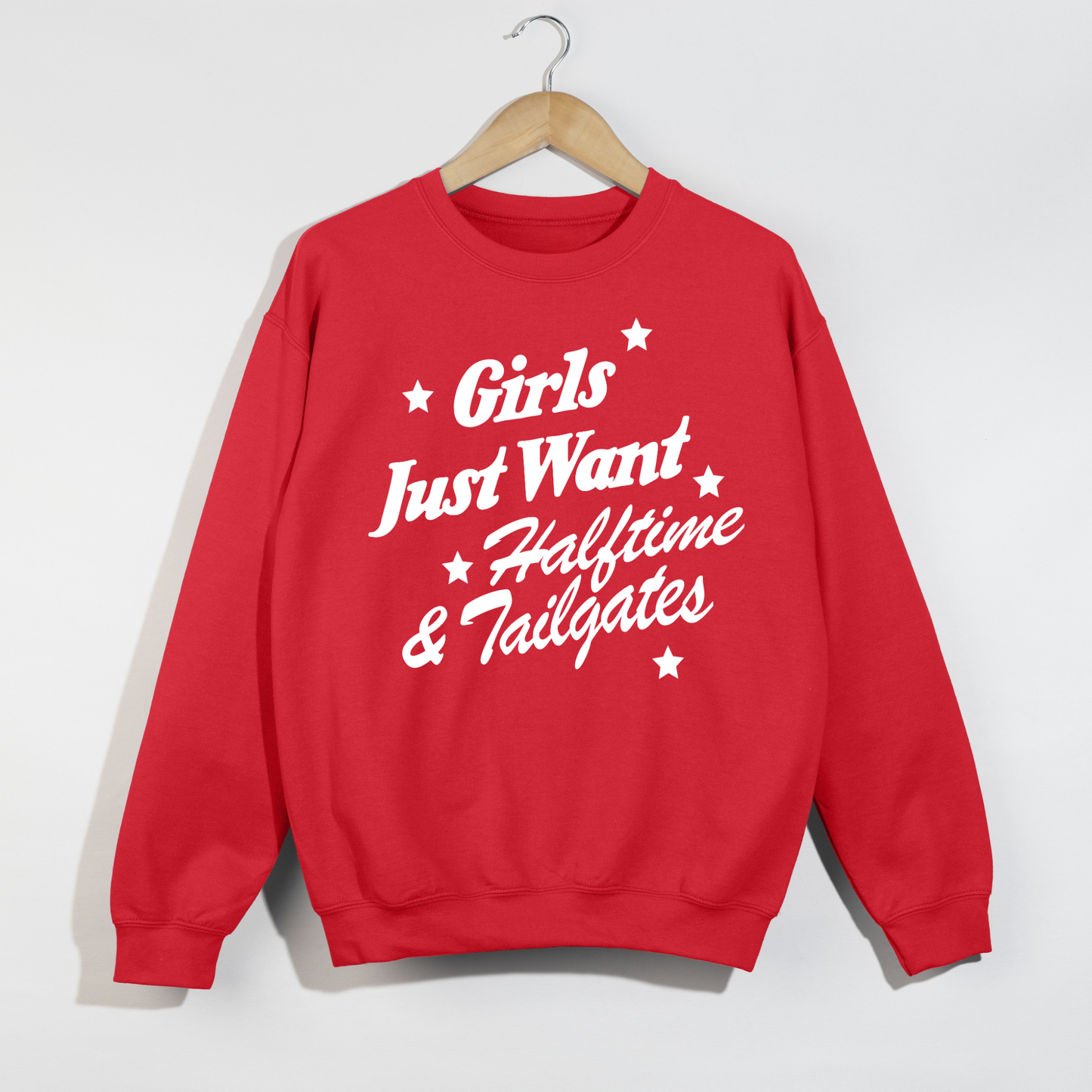 Red football game day crewneck sweatshirt featuring the bold white "Girls Just Want Halftime & Tailgates" graphic in a retro vintage style, perfect for tailgates, football season, and stadium outfits.