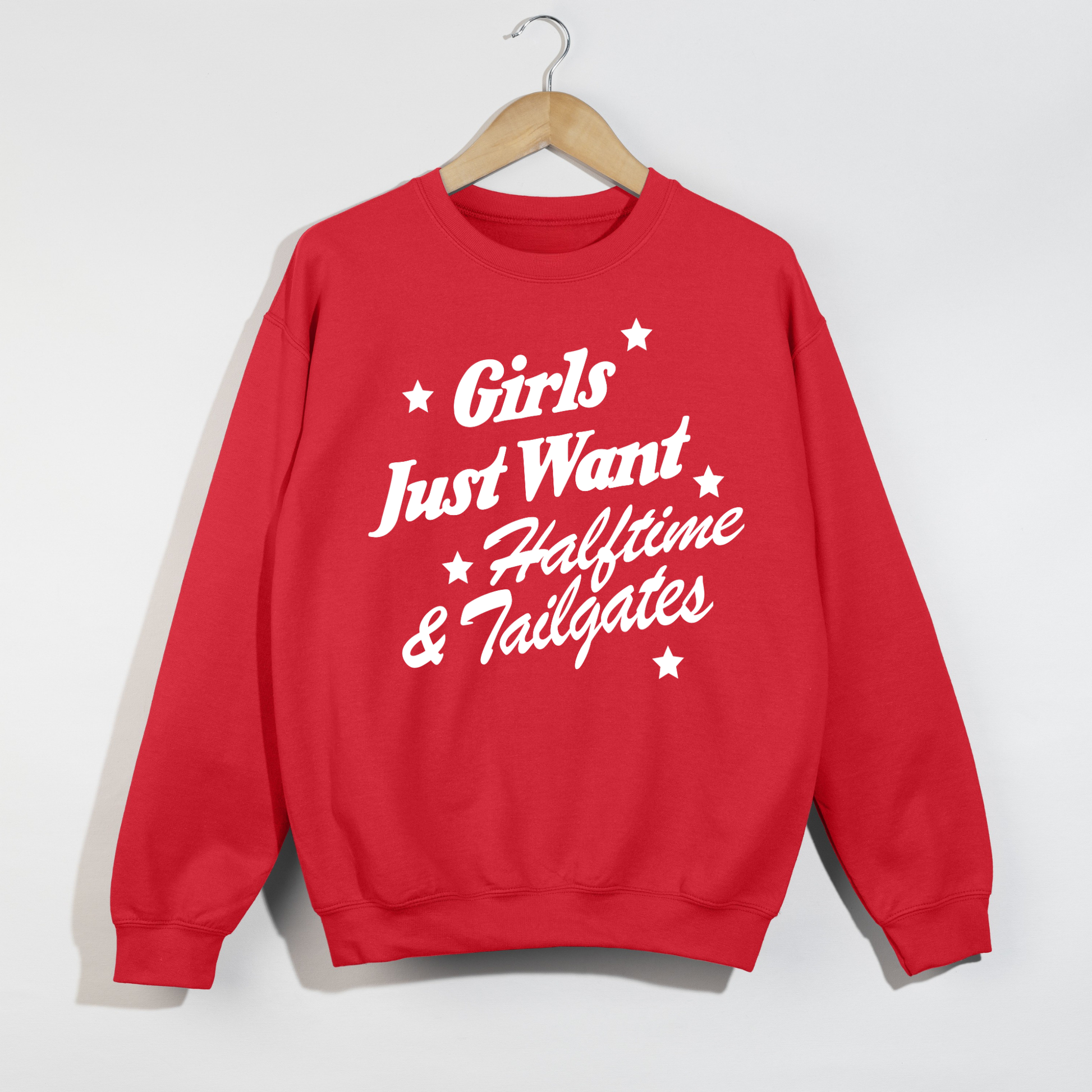 Red football game day crewneck sweatshirt featuring the bold white "Girls Just Want Halftime & Tailgates" graphic in a retro vintage style, perfect for tailgates, football season, and stadium outfits.