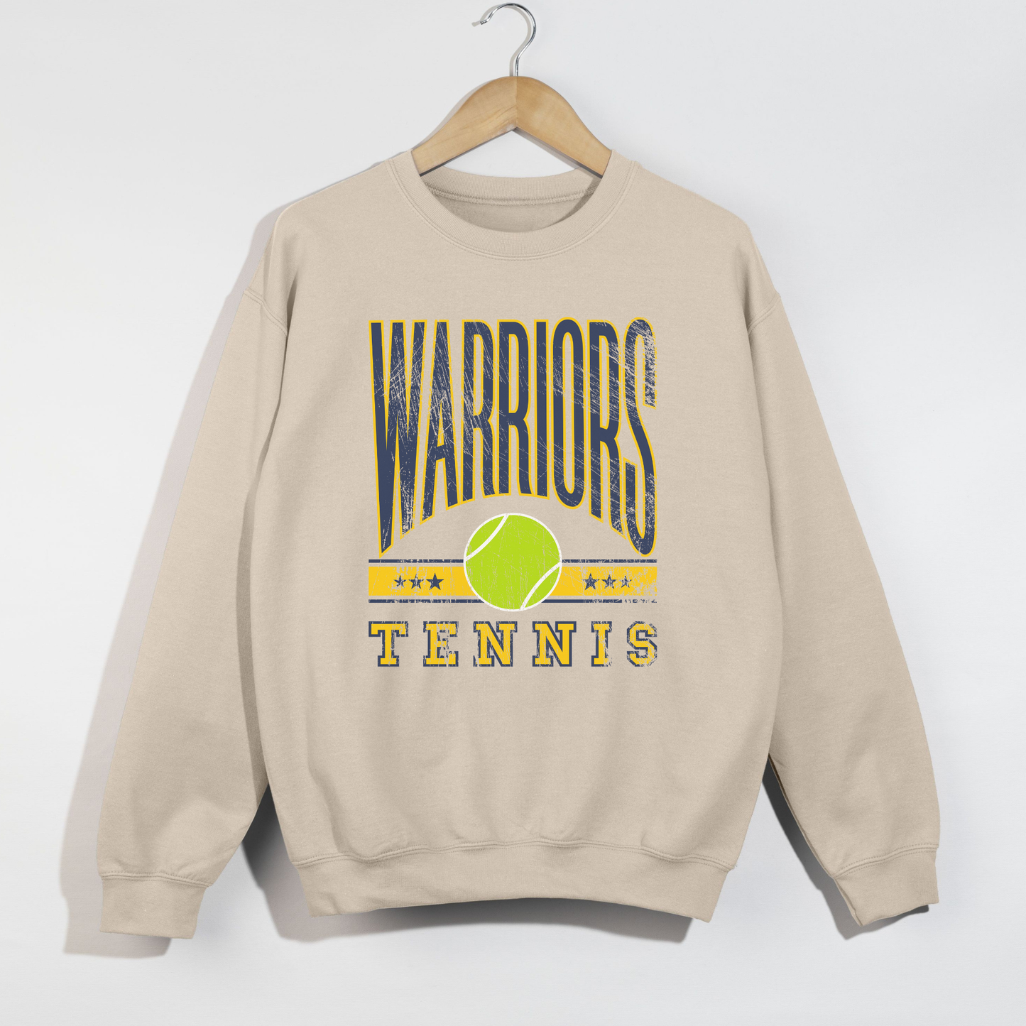 Vintage Warriors Tennis graphic crewneck sweatshirt in sand color featuring navy and gold lettering with a green tennis ball design