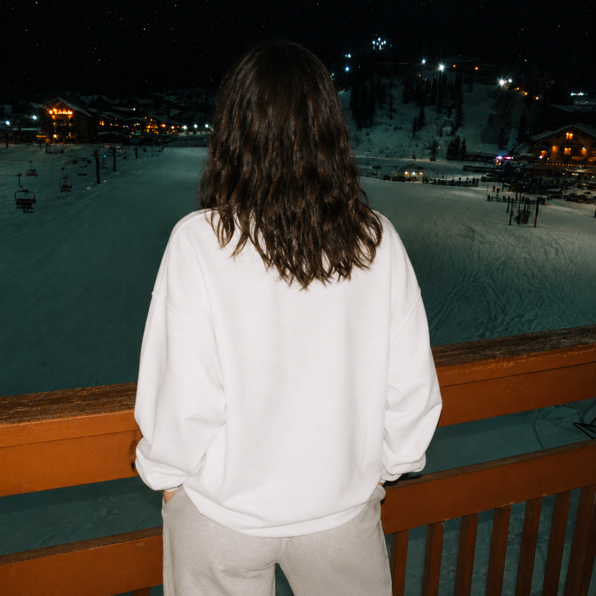 Back view of white bridal crewneck sweatshirt at winter ski resort