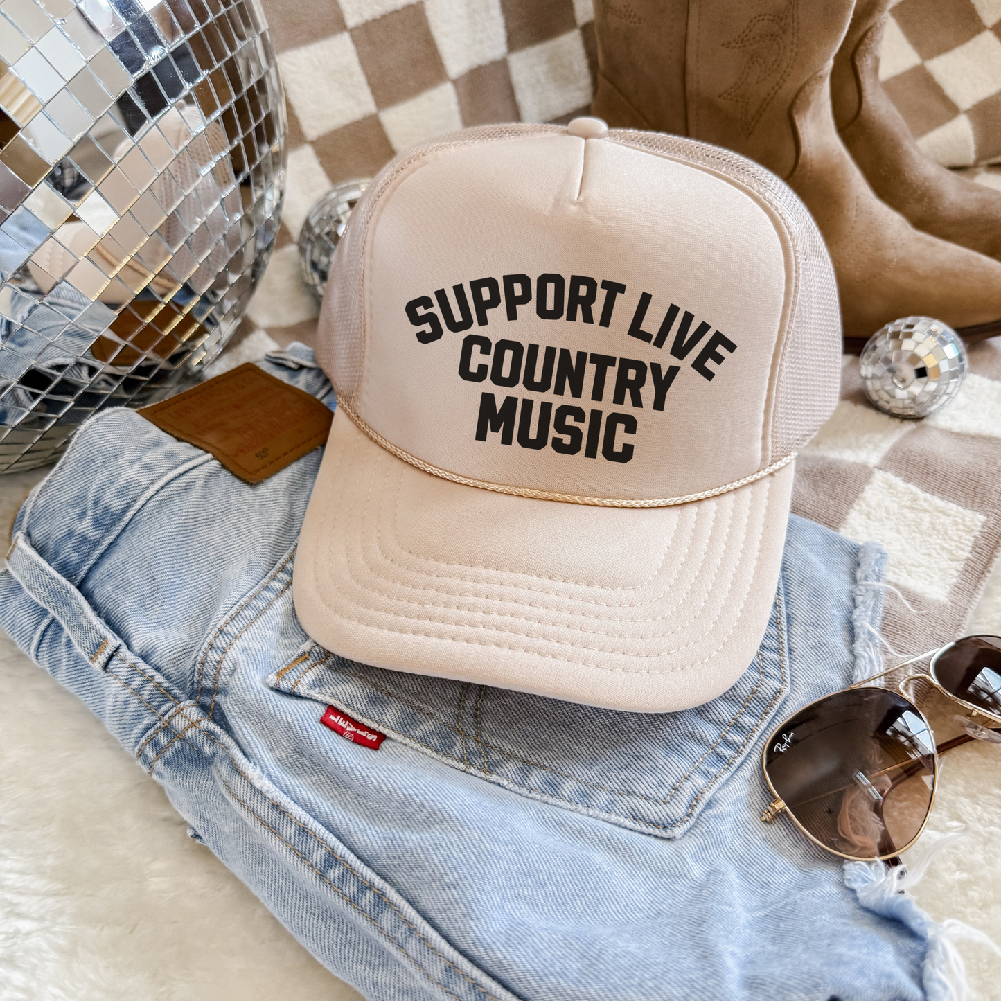 Tan Otto 39-165 foam front trucker hat with Support Live Country Music graphic styled with denim, boots, and disco ball