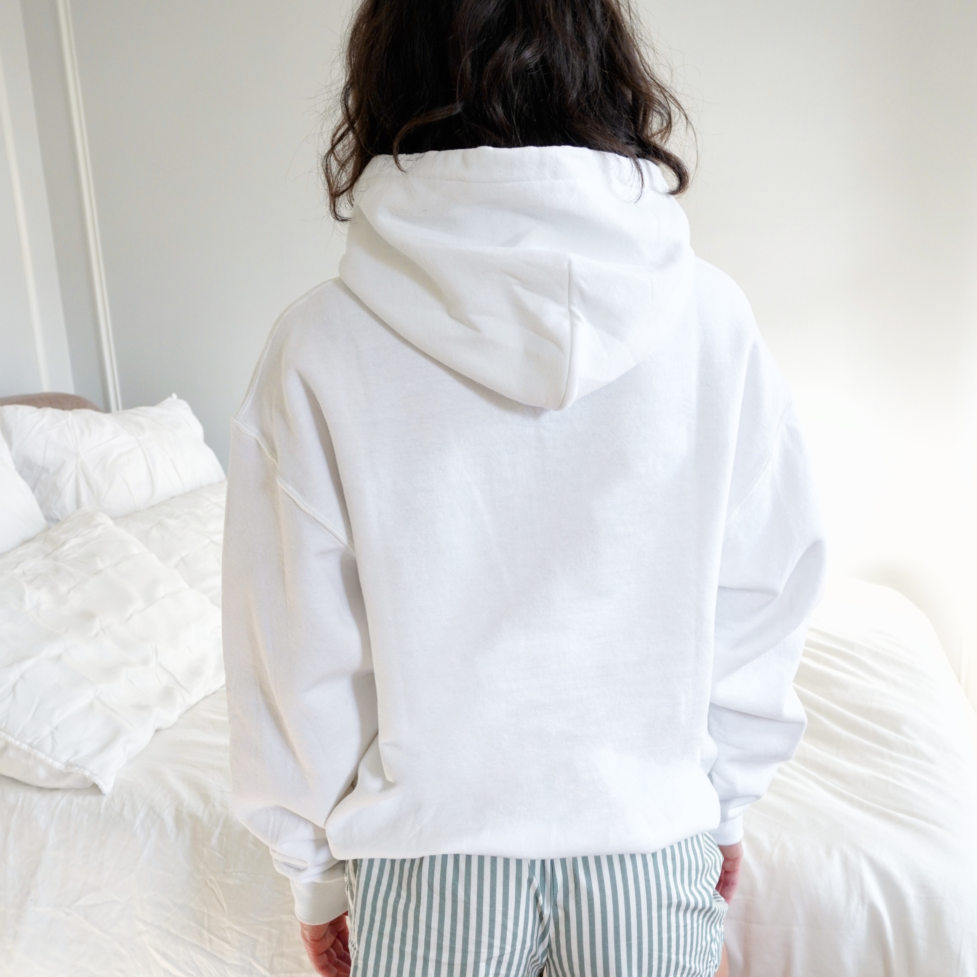 Back view of PRAY faith hoodie showing oversized cozy silhouette