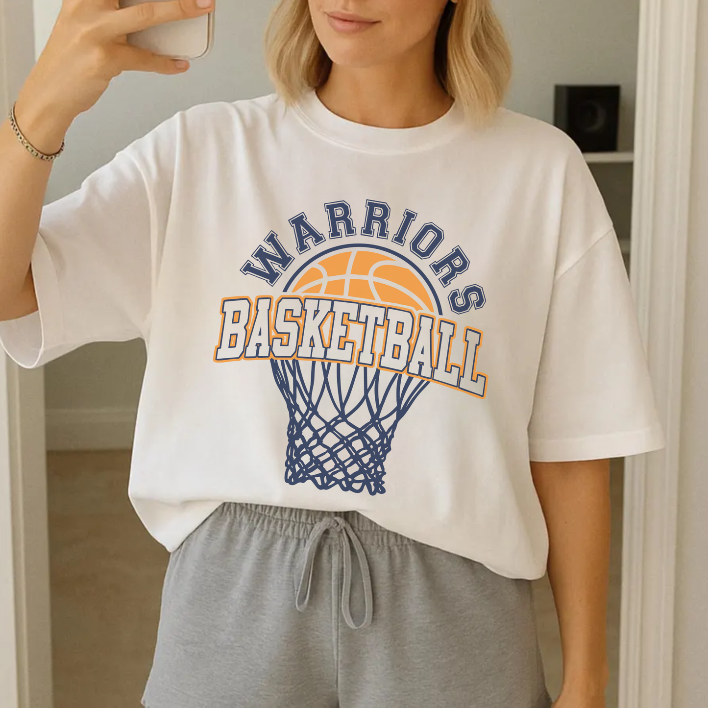 White Warriors Basketball graphic tee styled casually for everyday school spirit wear