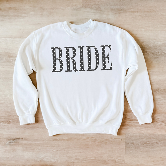 White BRIDE polka dot crewneck sweatshirt flat lay on wood floor