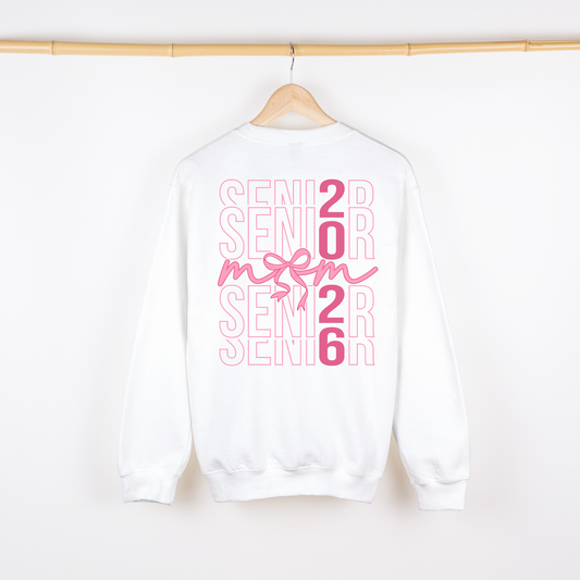 White sweatshirt with pink 'Senior 2026' text on a hanger against a white background