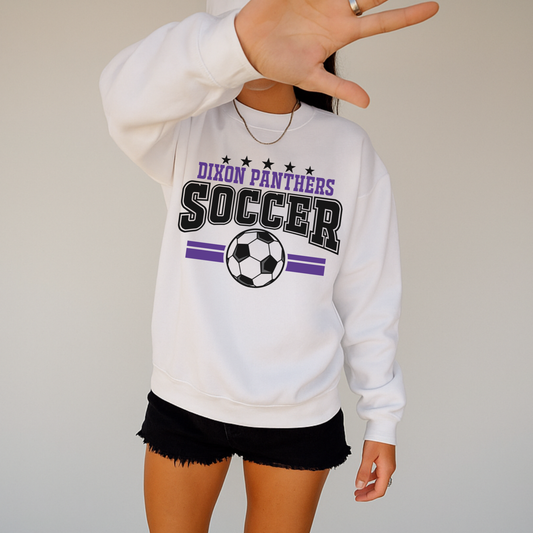 Woman wearing white Dixon Panthers varsity soccer crewneck sweatshirt with purple and black design