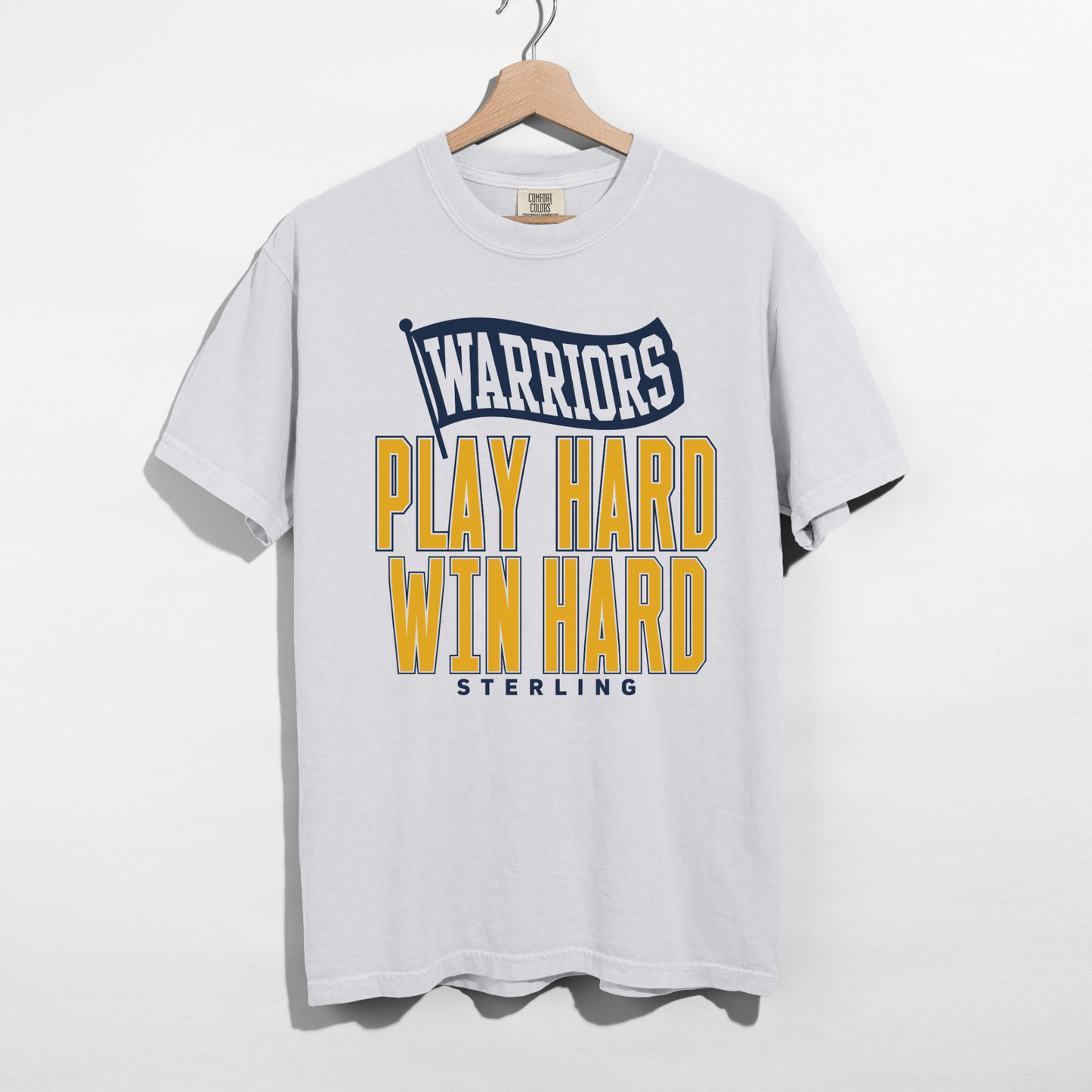 White Comfort Colors Sterling Warriors Play Hard Win Hard unisex graphic tee with navy and gold athletic school spirit design.