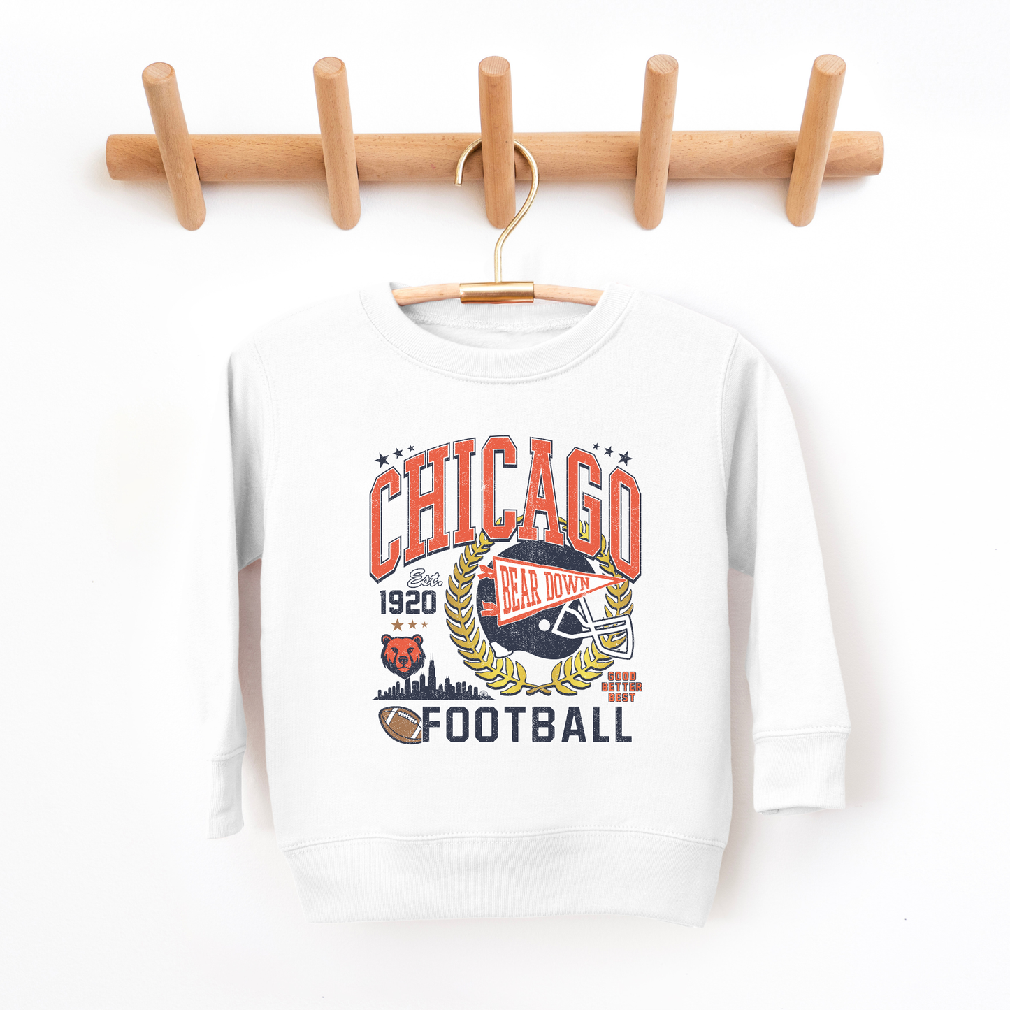 White sweatshirt with 'Chicago Football' graphic on a wooden hanger against a white background